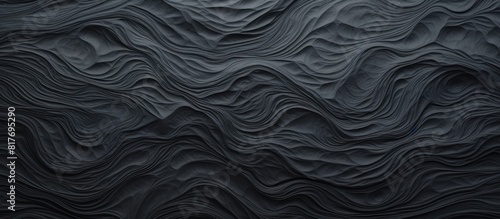 A textured black paper creating a backdrop for a copy space image