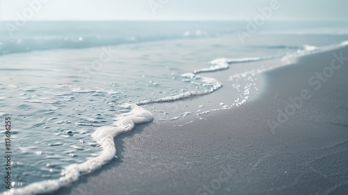 Soft Grey Sand Waves Along a Tranquil Seashore, Ideal for Calming and Meditative Visual Content