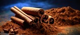 Dark copy space image featuring sticks of ground Ceylon cinnamon on a contrasting background
