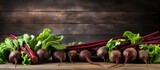 A copy space image featuring organic beetroots displayed close up on a rustic wooden table