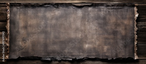 A scroll made of aged charred paper is fastened to weathered wooden planks offering ample space for your text