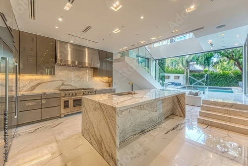 Contemporary kitchen with a waterfall edge marble island.