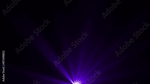 Purple color optical flares or futuristic light rays shining on black background