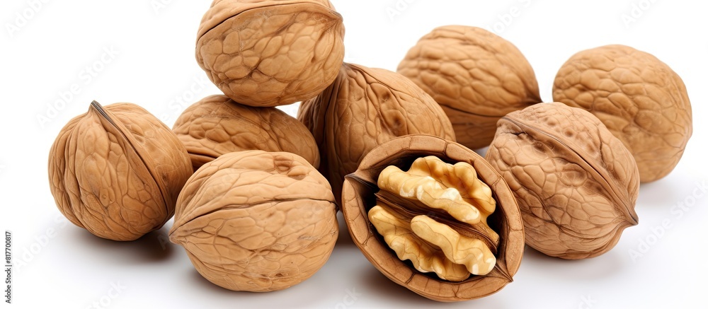 A top view of a bowl of walnuts isolated on a white background providing copy space for adding text or images to the image A top view of a bowl of walnuts isolated on a white background providing copy space for adding text or images to the image