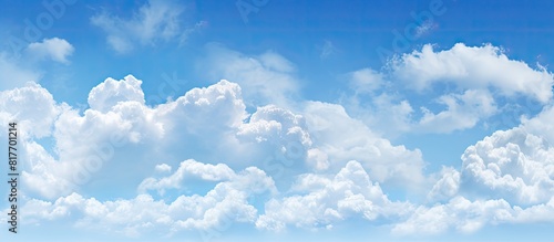 Copy space image with a background of a light blue sky and white clouds