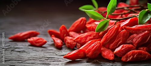 The Goji berry also known as wolfberry and scientifically named Lycium Barbarum is a small bright red fruit. Creative banner. Copyspace image photo