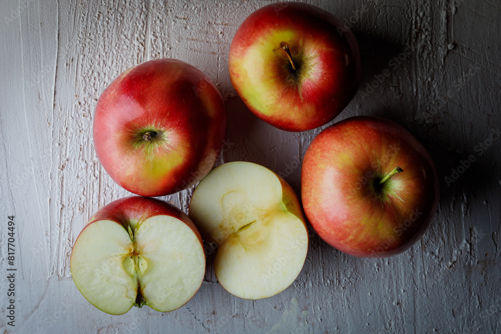 Four Polish red apples on a rustic background Four Polish red apples on a rustic background
