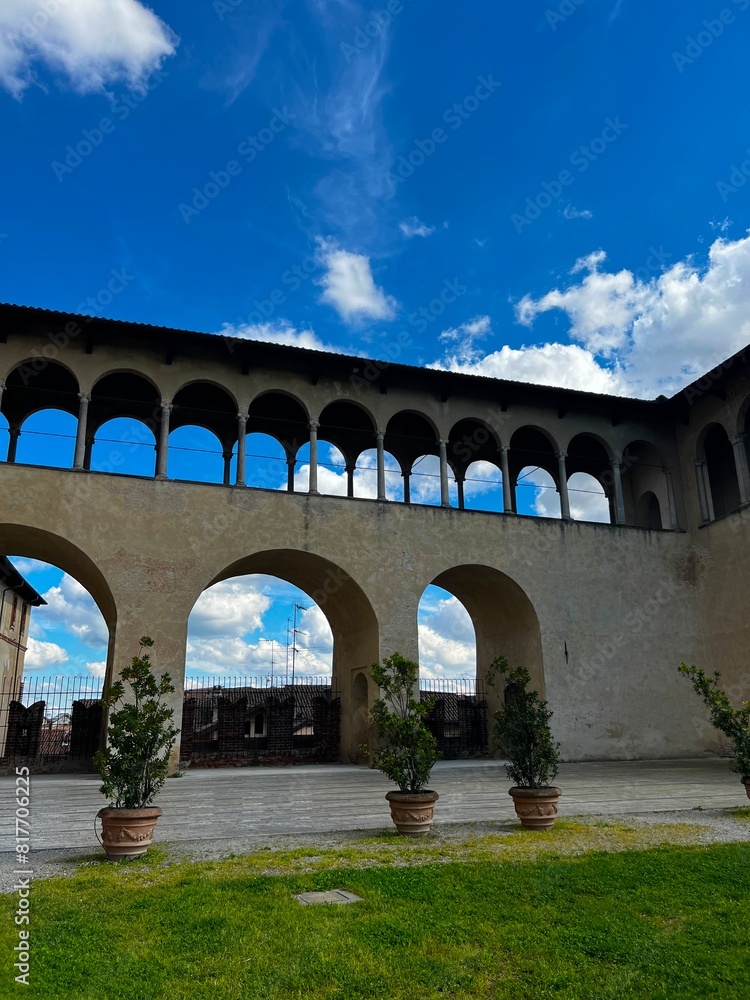 Obraz premium Detail of the Ducale Palace in Vigevano city centre Lombardy Region, Northern Italy. In the picture, the backyard of the palace and its public garden.