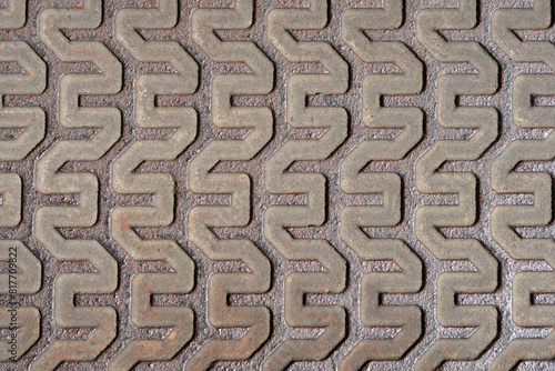 Metal texture - close up detail of a manhole cover