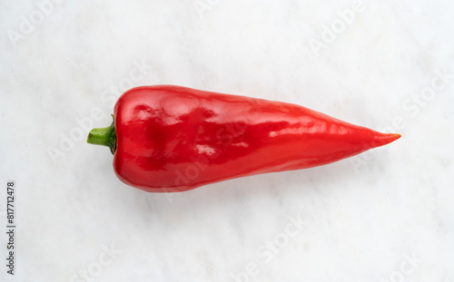 Red Ramiro Pepper on a white marble background top view