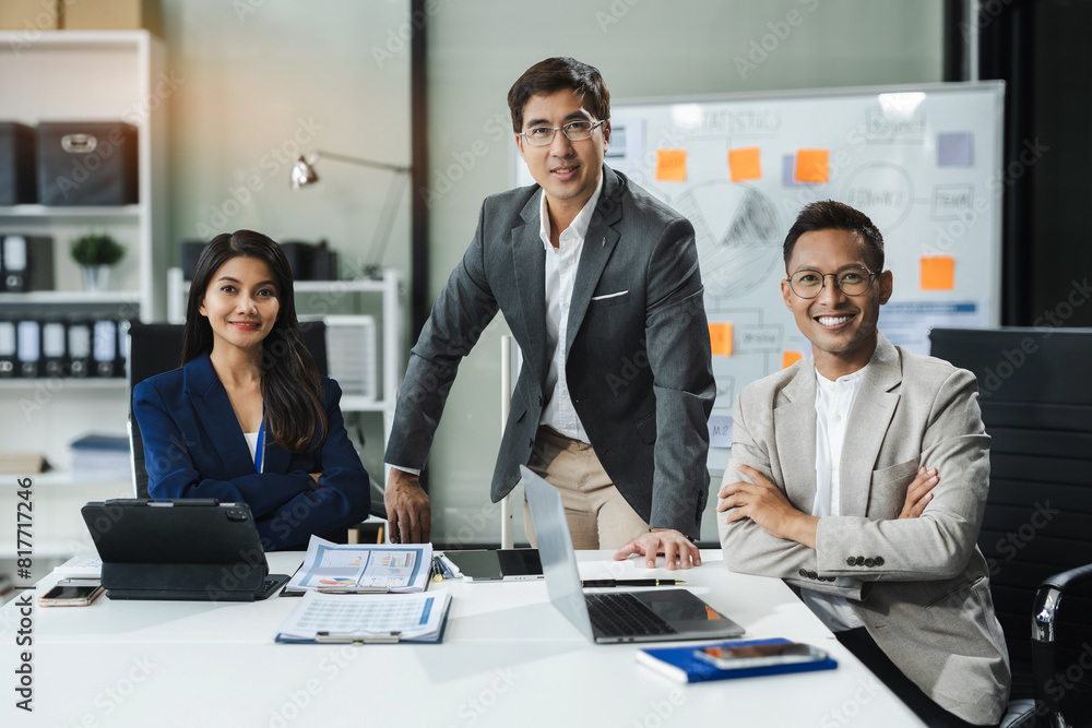 Group of Young Asian business team creative businesspeople coworker in office Happy to be successful partnership teamwork success concept. Group of Young Asian business team creative businesspeople coworker in office Happy to be successful partnership teamwork success concept.