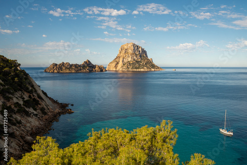Sailboat sailing on turquoise waters around Es Vedra island, Sant Josep de Sa Talaia, Ibiza, Balearic Islands, Spain
