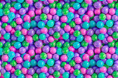 A colorful pile of small balls, some of which are pink and some are green