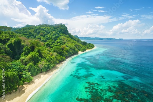 Beautiful tropical beach with turquoise water and lush forest.