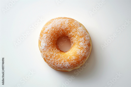 A donut with sugar on top, photographed from above against white background