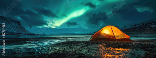 A glowing yellow camping tent under a beautiful green northern lights aurora. Travel adventure landscape background. Photo composite photo