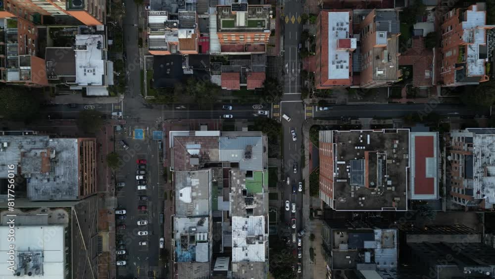 Top-down shot of Bogota, Colombia, with cars moving next to the buildings. Top-down shot of Bogota, Colombia, with cars moving next to the buildings.