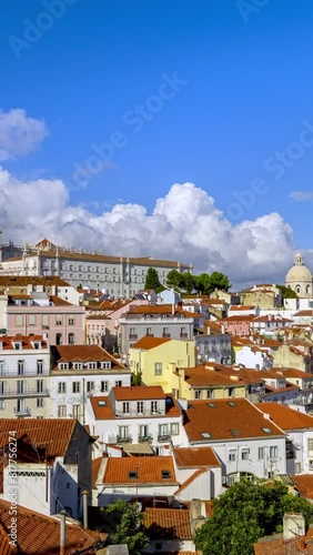 Clouds fly over iconic view of Lisbon historic center on sunny day