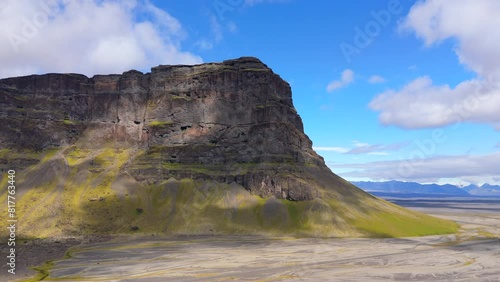 A close-up aerial view of a towering cliff on an Icelandic plateau, highlighting rugged natural beauty and majestic landscapes. Perfect for nature lovers and adventurers. Drone view, Iceland.  photo