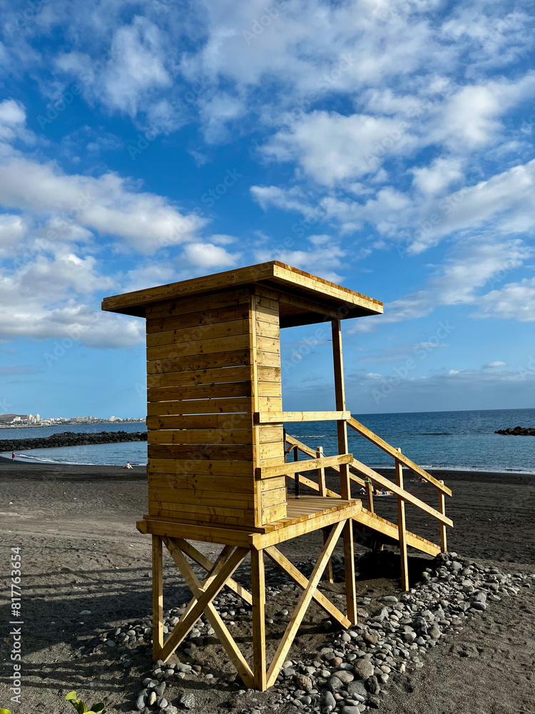 Baywatch Tower on a beach in the morninng, El Duque, Tenerife, Canary Islands, Spain. Vertical Baywatch Tower on a beach in the morninng, El Duque, Tenerife, Canary Islands, Spain. Vertical