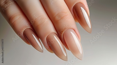 Female hands with beige nail design. Brown manicure with varnish