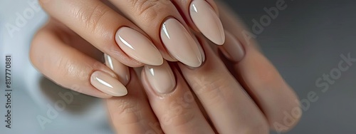 Female hands with beige nail design. Brown manicure with varnish