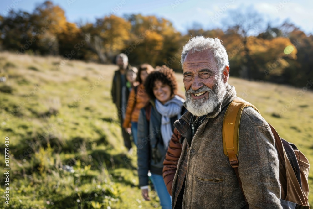 Portrait of senior man with his family on a hike in nature