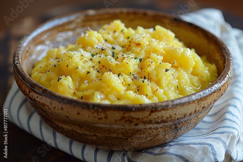 Risotto alla Milanese: Creamy saffron-infused risotto with a bright yellow color and a slightly glossy finish. -