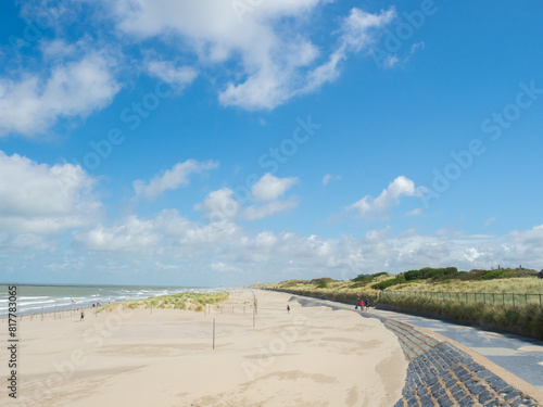 Oostende, Belgium - August 1st 2023: The beach promenade and dunes at the coast close to the city.
