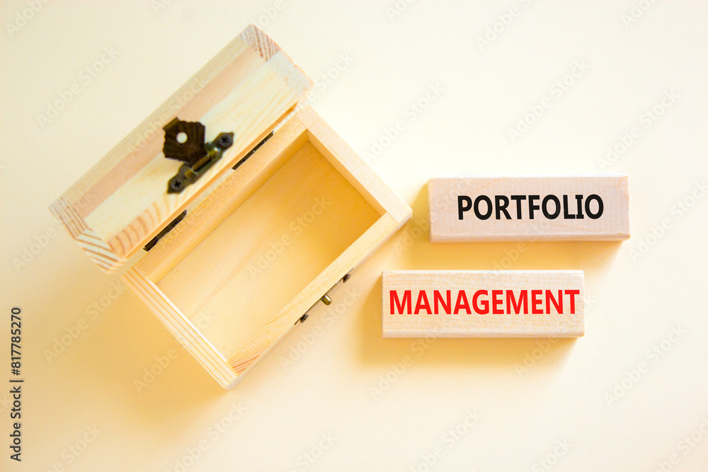 Portfolio management symbol. Concept words Portfolio management on beautiful wooden block. Beautiful white paper background. Empty wooden chest. Business Portfolio management concept. Copy space. Portfolio management symbol. Concept words Portfolio management on beautiful wooden block. Beautiful white paper background. Empty wooden chest. Business Portfolio management concept. Copy space.