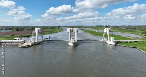 Maurik hydroelectric power station. Kaplan turbine for electricity generation in typical dutch landscape at springtime. Sustainable energy, clean green energy. Aerial drone view. photo
