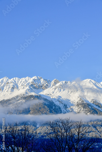 The mountains of the Nordkette surround Innsbruck in Tyrol with the summit Hafelekar photo