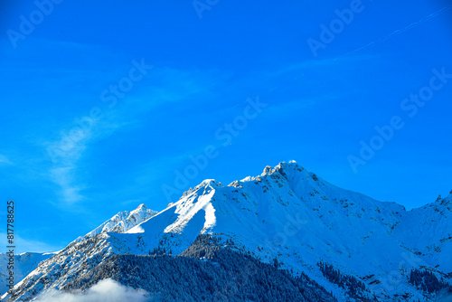The mountains of the Nordkette surround Innsbruck in Tyrol with the summit Hafelekar photo