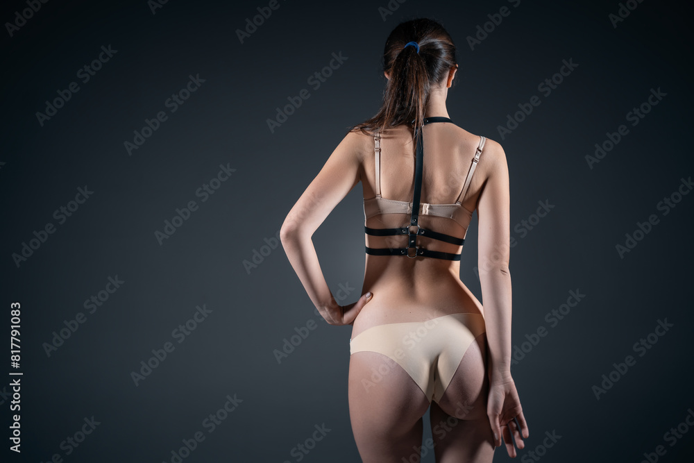 sexy naked striptease woman in black leather harness bondage, sensual nude stripper female in bdsm seductive lingerie, sex role play