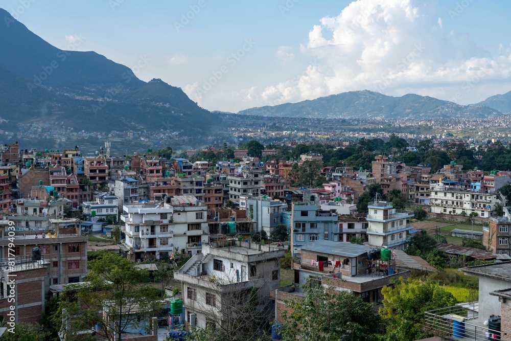 Several homes in urban area and mountains in background during day time Several homes in urban area and mountains in background during day time
