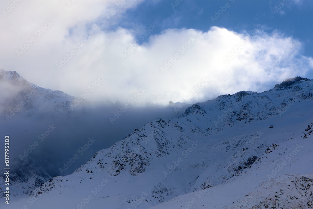 Picturesque winter landscape with serene snowy mountains in Georgia, Stepantsminda Picturesque winter landscape with serene snowy mountains in Georgia, Stepantsminda