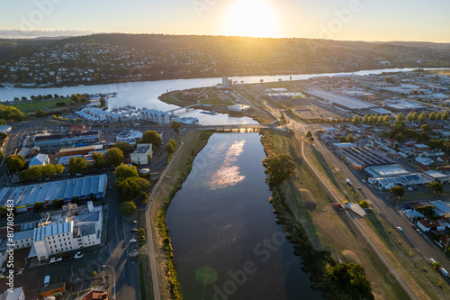 Aerial photo looking out over Launceston above the North Esk River at sunset with blue sky photo