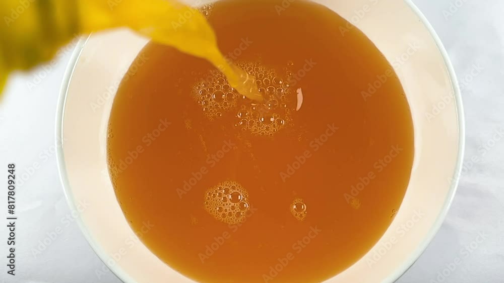 slow motion shot of pouring orange juice, fresh organic orange juice slow motion shot of pouring orange juice, fresh organic orange juice