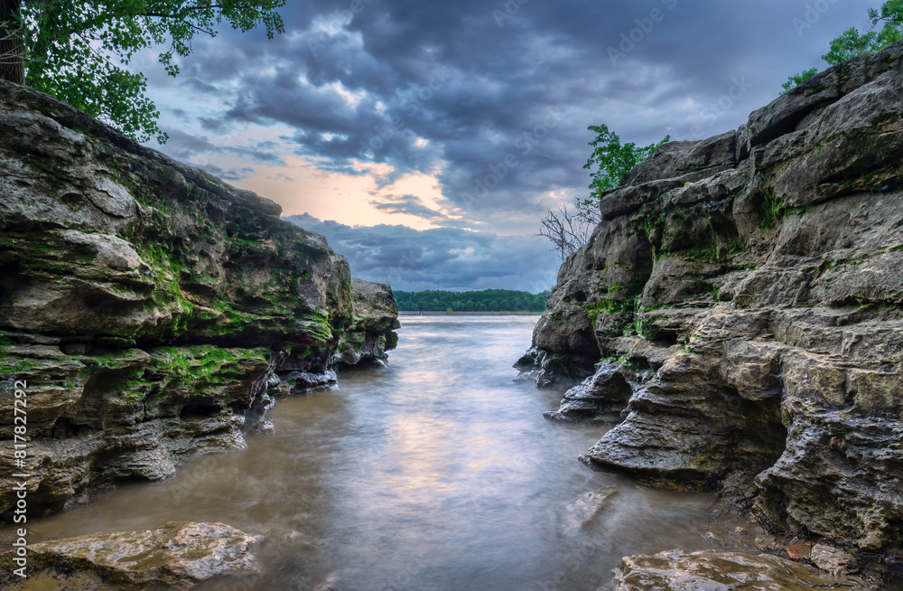 River inlet with rock walls at sunset River inlet with rock walls at sunset