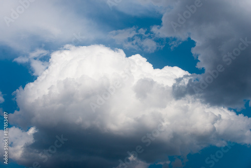 A large cumulus cloud against a blue sky