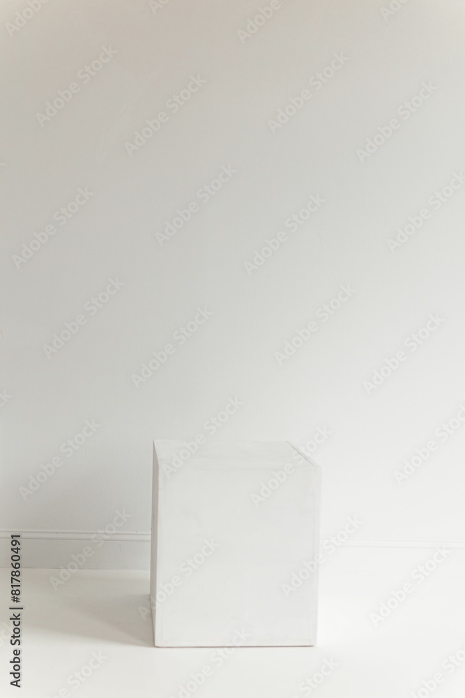 a white box that is on the floor with one side down a white box that is on the floor with one side down
