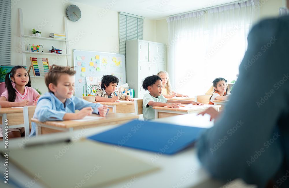 Teacher and students, Learn and study in a classroom of school where youngsters sit and listen attentively. Teacher and students, Learn and study in a classroom of school where youngsters sit and listen attentively.