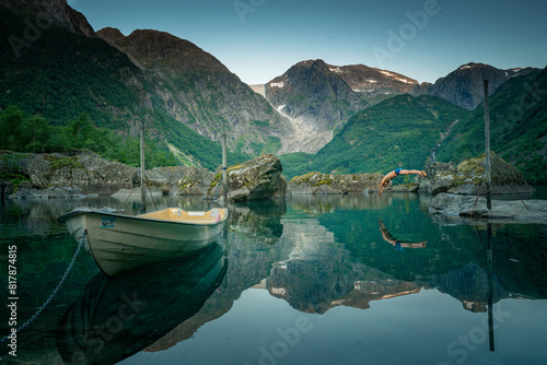 Beautiful Glacial Fjord: Sunny Day in Western Norway with Reflective Waters and Lush Greens photo