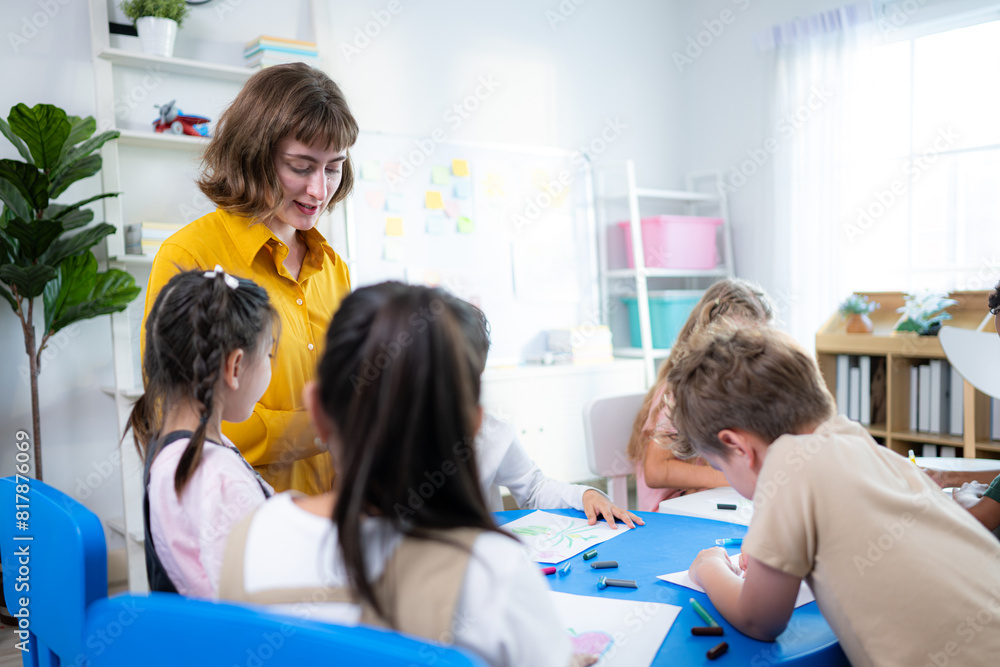 Teacher and students, Learn and study in a classroom of school where youngsters sit and listen attentively. Teacher and students, Learn and study in a classroom of school where youngsters sit and listen attentively.