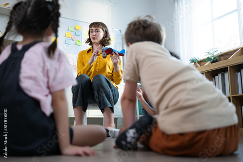 Teacher and students, Learn and study about airplanes in a classroom of school where youngsters sit and listen attentively.