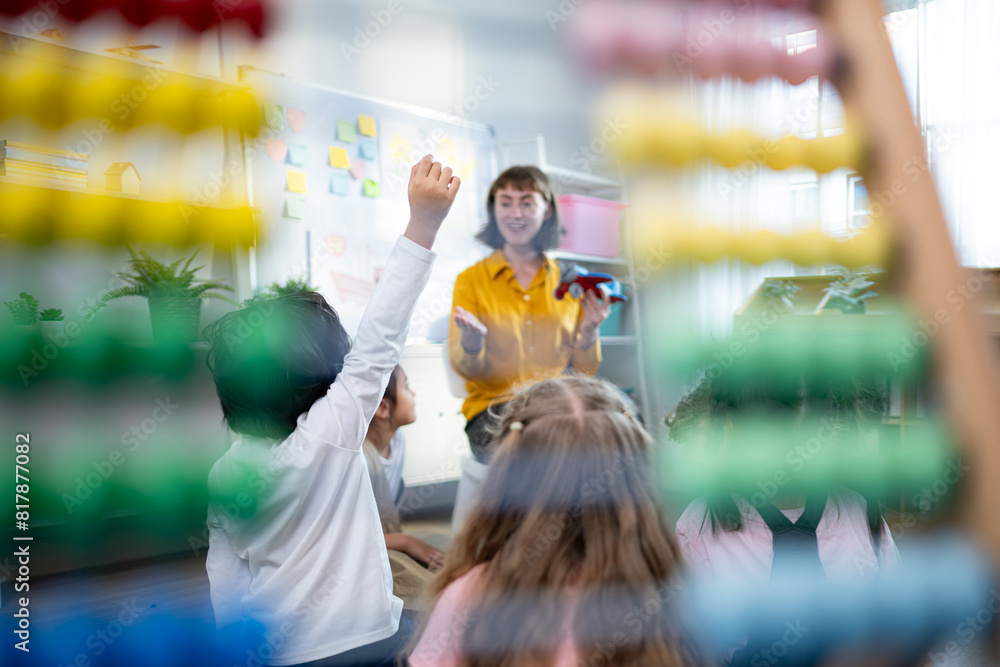 Teacher and students, Learn and study about airplanes in a classroom of school where youngsters sit and listen attentively. Teacher and students, Learn and study about airplanes in a classroom of school where youngsters sit and listen attentively.