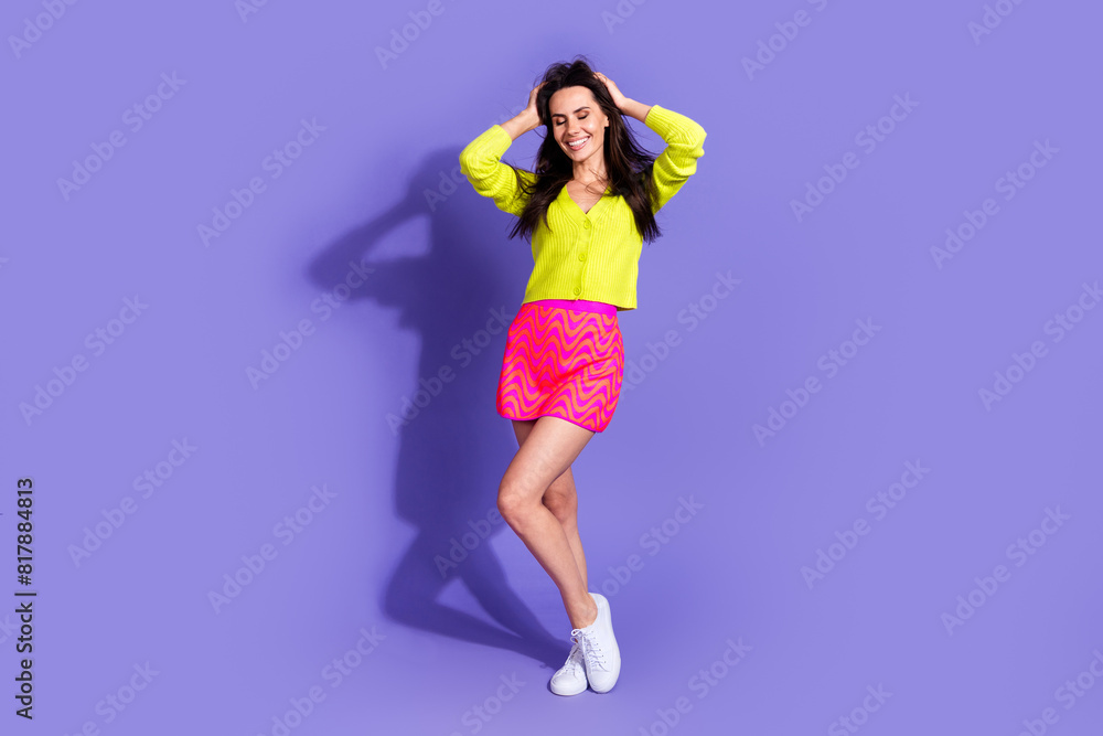 Photo of cute lovely positive nice girl wear stylish clothes have fun isolated on purple color background Photo of cute lovely positive nice girl wear stylish clothes have fun isolated on purple color background
