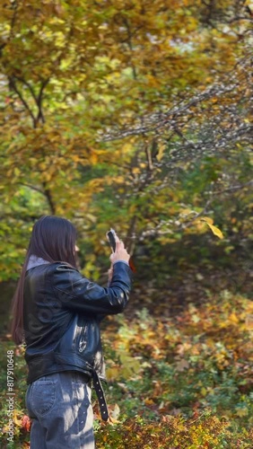 Wallpaper Mural A radiant, enchanting girl takes a leisurely stroll through the park, enveloped in the golden hues of autumn. Torontodigital.ca