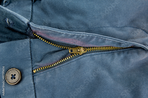 Old pants zip with a fade out fabric color