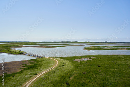 National Park in Holland. Landscape in spring on a sunny day. Path over sea. Netherlands, Zeeland, Oosterschelde.